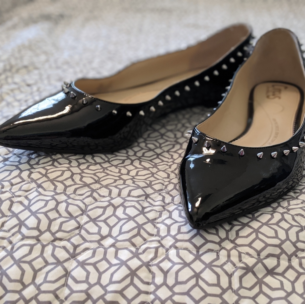 Black flats with spikes